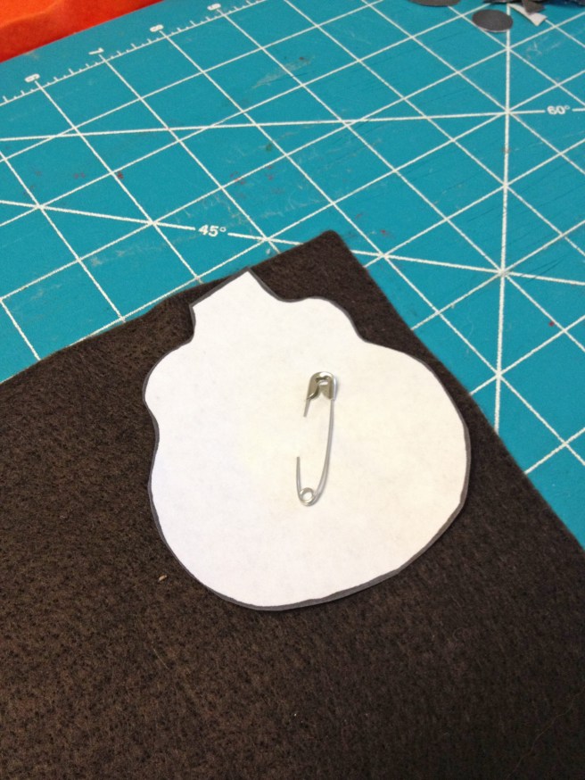 Pin blank template to brown felt and cut around edge.