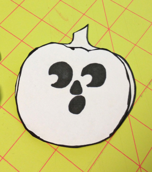 Place face pumpkin on matching blank and check for any overlapping. This particular pumpkin is not perfect, so you'll have to trim so both pieces are the same!